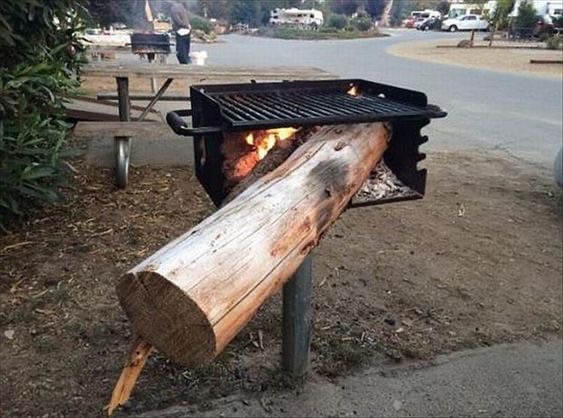 Giant Log Placed On a Tiny Grill