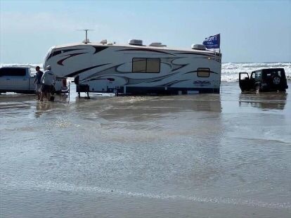 RV Parked in the Middle of the Sea