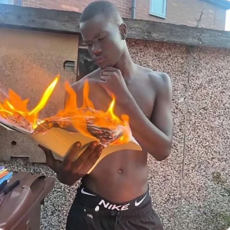 Boy Reading a Book That’s Catching Fire