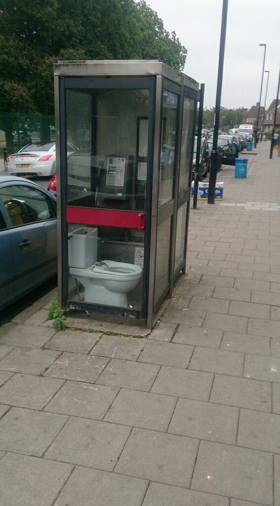 A Toilet Installed Inside a Public Phone Booth