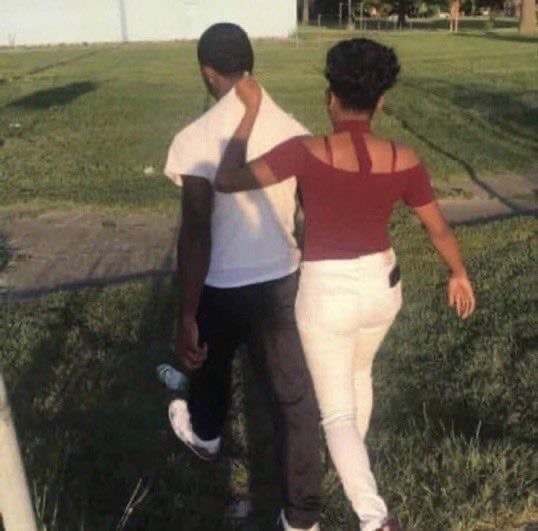 Girl Pulling Her Boyfriend by His Shirt