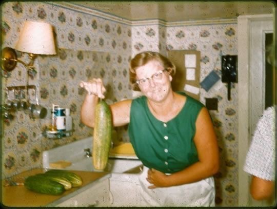 Grandma Showing Off a Homegrown Zucchini