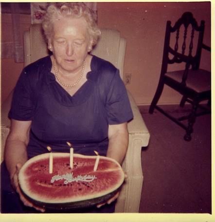 Grandma Holding a Literal Watermelon Cake