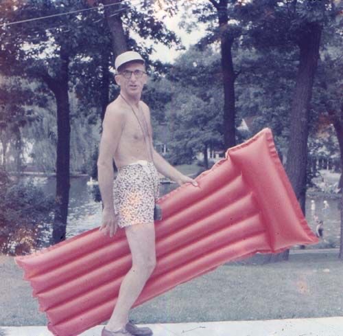 Man Holding a Pool Inflatable 