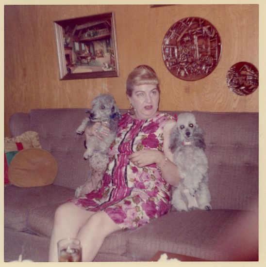 Lady on the Couch With Two Identical Dogs