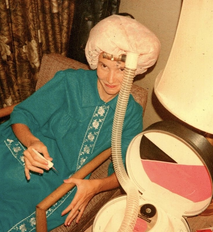 Woman With a Hair Machine For Hot Rollers