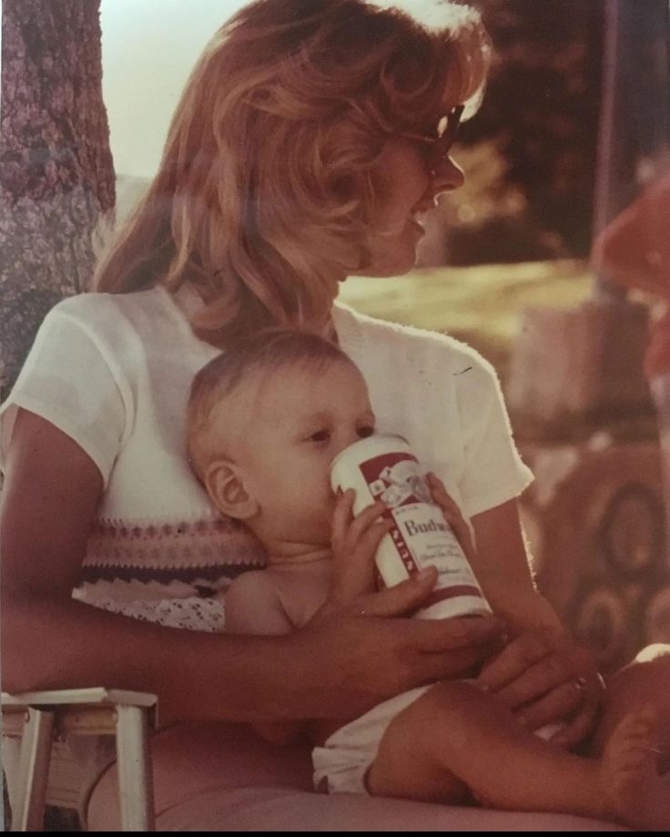 Mom Giving a Beer Can to a Baby