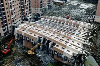 Entire apartment block tips over