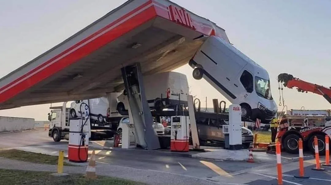 Van crashing through gas station