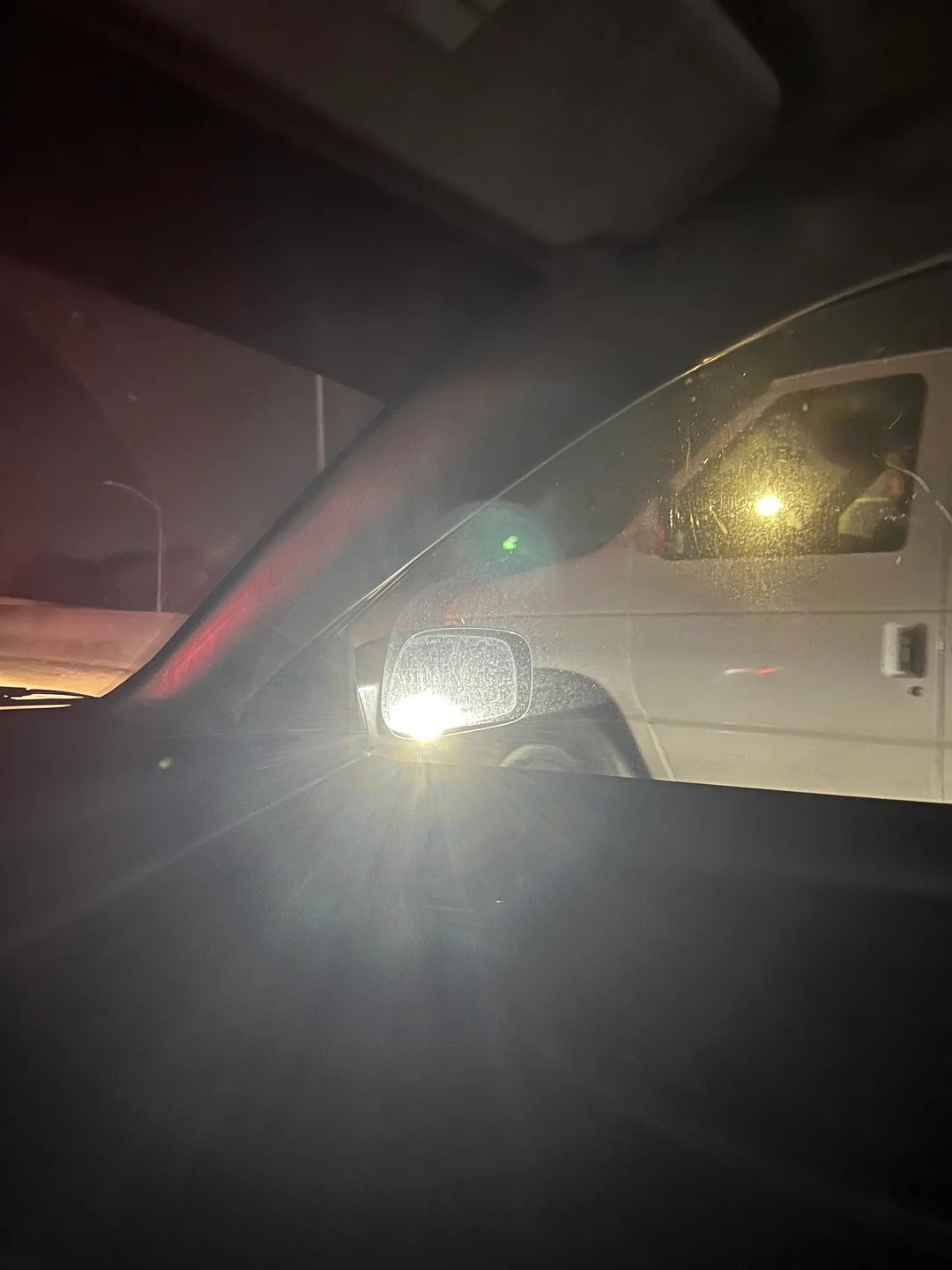 High beams shining through the mirror