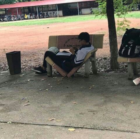 Dude Lying on a Broken Street Bench