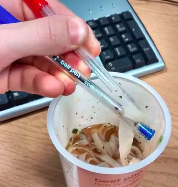 Boy Using Pens Instead of Chopsticks