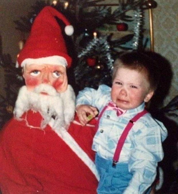 Scary Santa Holding a Crying Baby