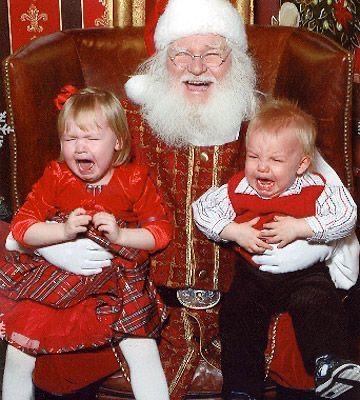 Santa Holding Two Crying Babies