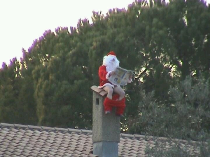 Santa Using a Chimney as a Toilet