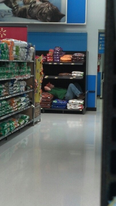 Man Lies Down in the Dog Food Aisle