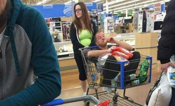 Girl Pushes Her Boyfriend Around in a Cart