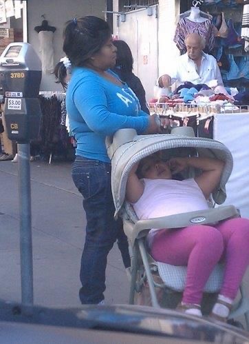 Woman Pushes Her Fully Grown Daughter in a Baby Stroller