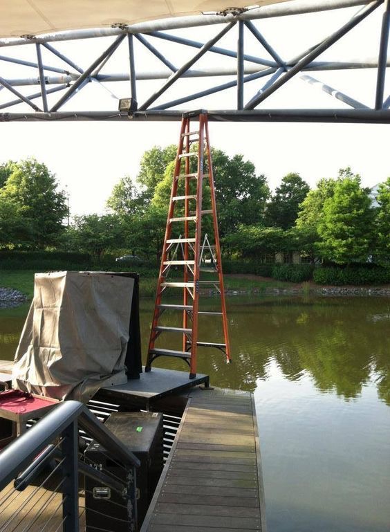Ladder Balanced Over Water