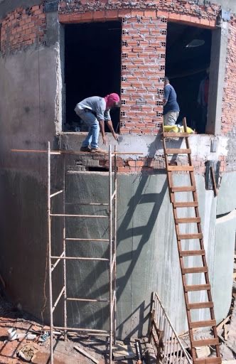 Man Standing on a Wobbly Wooden Plank