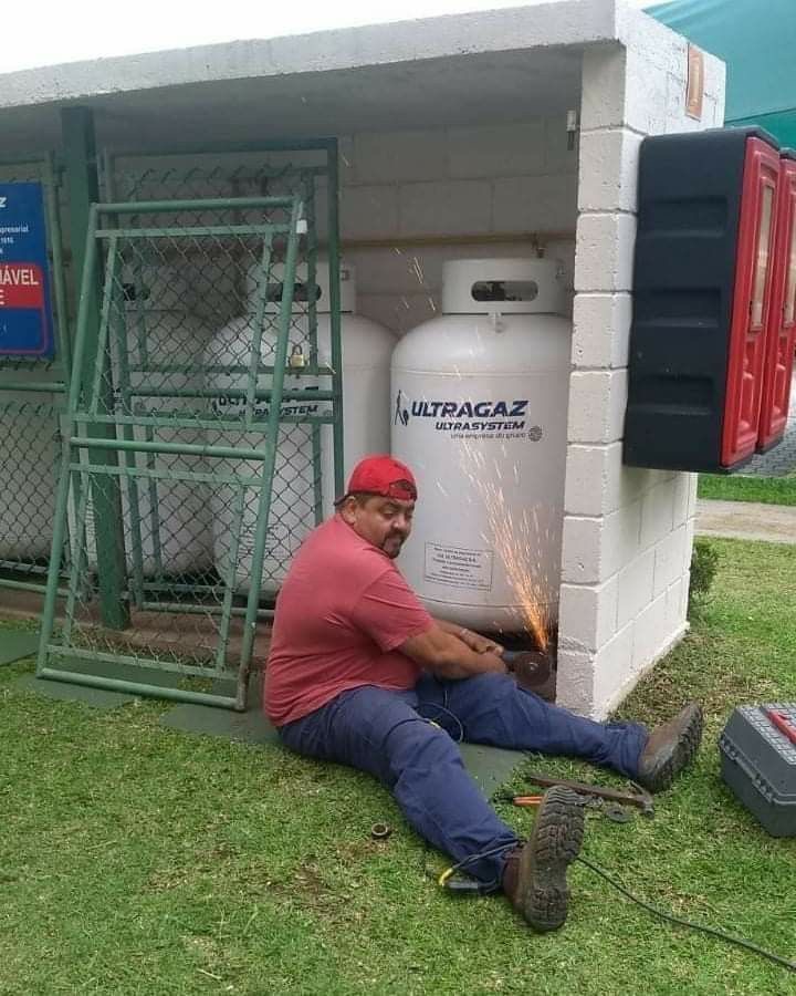 Man Fixing With No Helmet