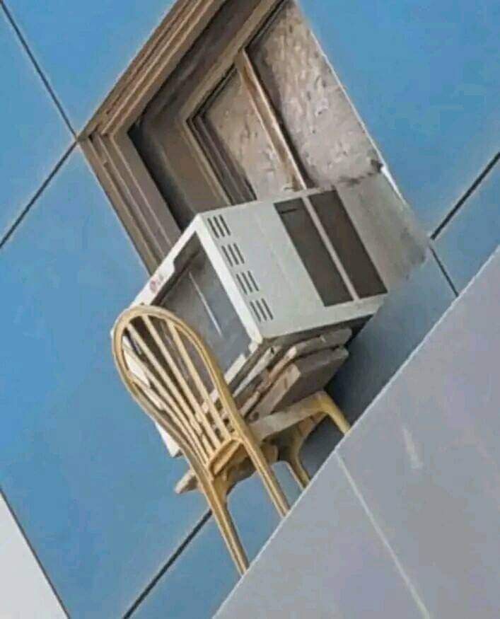 Chair Holding an Outdoor AC Unit