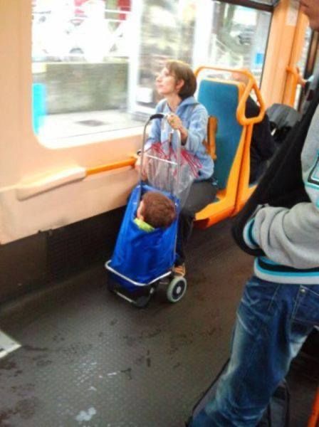 Woman on a Bus Carrying Her Child in a Bag