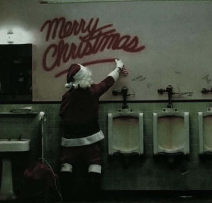 Santa Writing “Merry Christmas” in Bathroom Graffiti