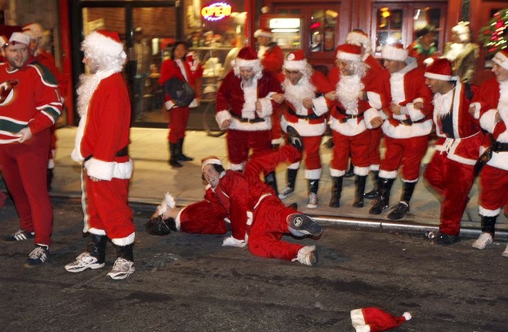 Santas Fighting on the Floor