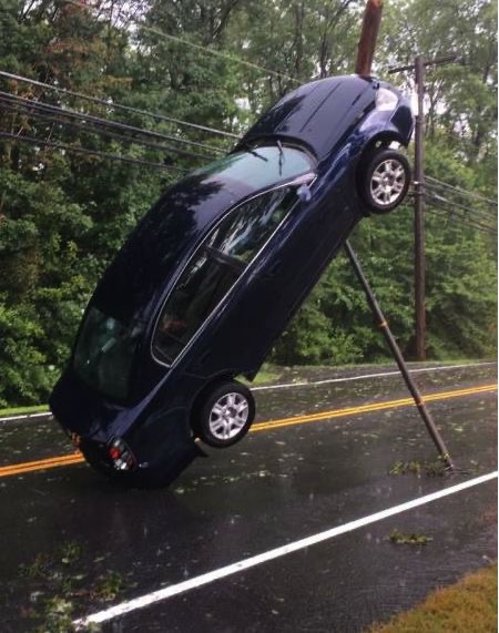 Car Hanging from Street Cables