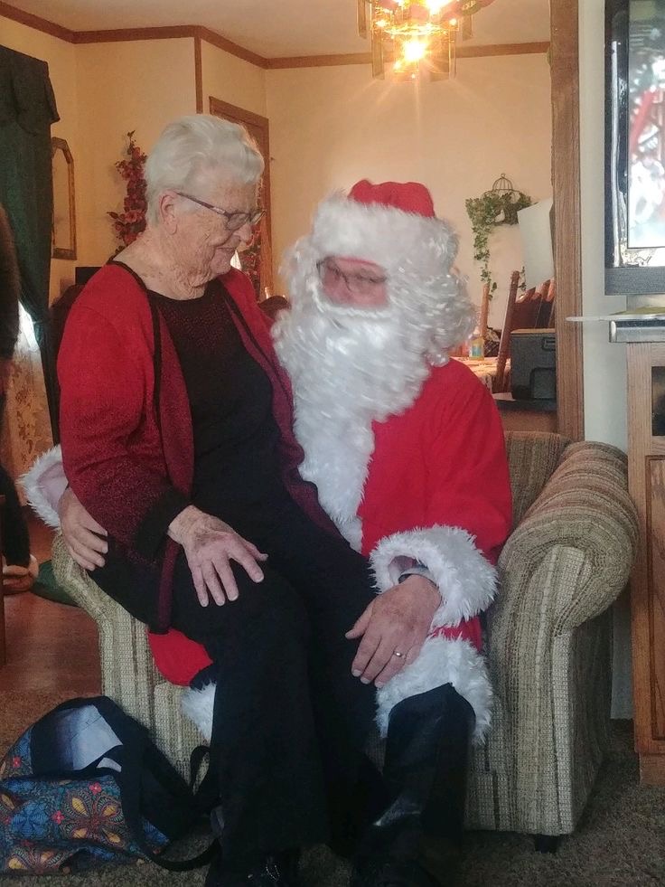 Santa with a Grandma Sitting on His Lap