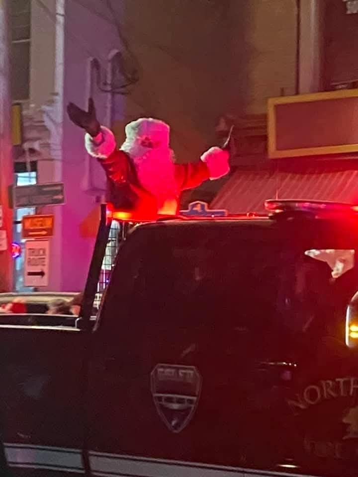Santa Standing on a Fire Truck