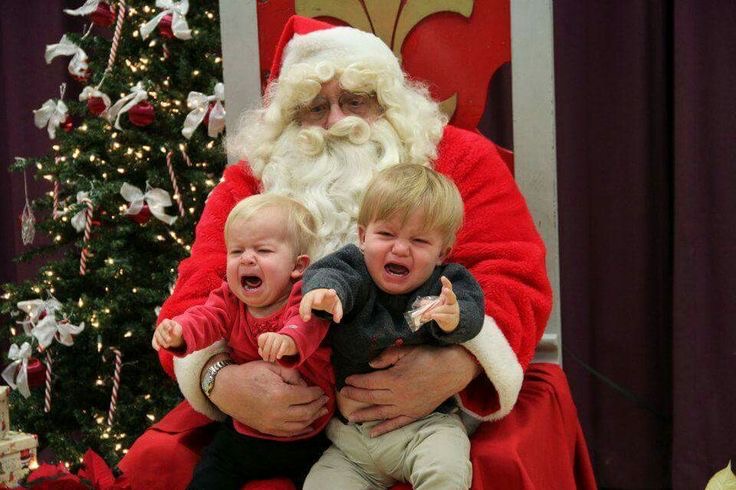 Santa Holding Two Crying Babies