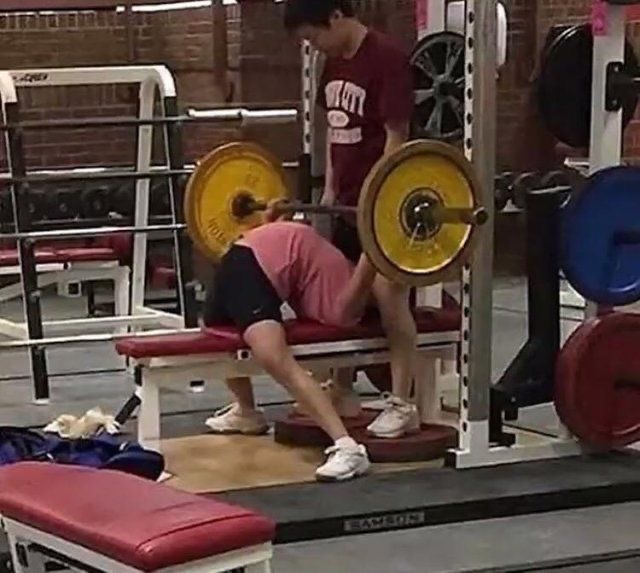 Guy Bending Way Too Much While Lifting Weights