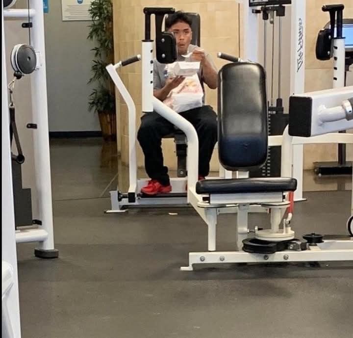 Guy Eating at the Gym