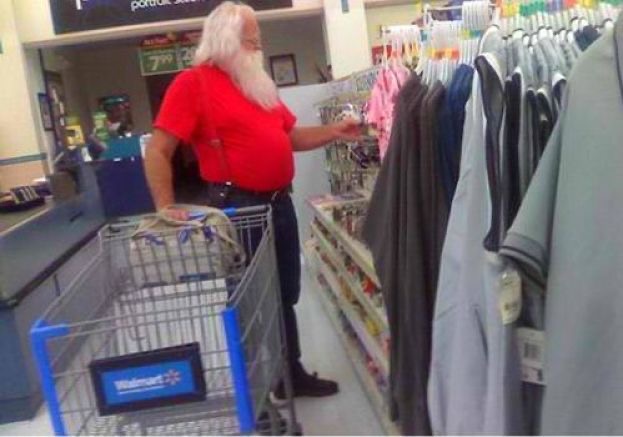 Santa Man in a Red Shirt Shopping for Clothes