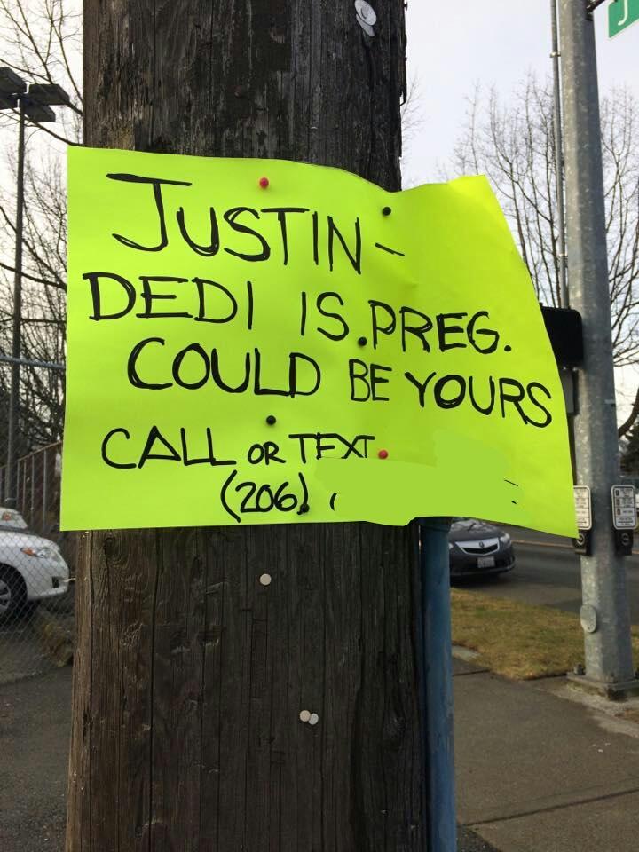 Sign stapled to a wooden post to Justin letting him know Dedi is pregnant and it might be his.