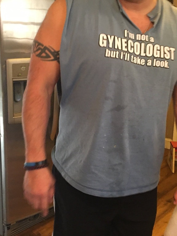 Dude wearing offensive shirt saying I am not a Gynecologist, but I can take a look.
