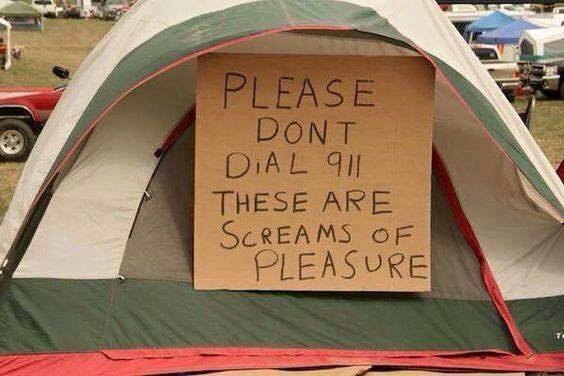 Tent in a very redneck setting with a cardboard sign in block letter explaining to please not call 911, the screams are of pleasure.