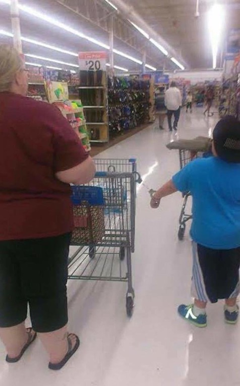 Wal-mart classic of kid handcuffed to a shopping cart with grandma