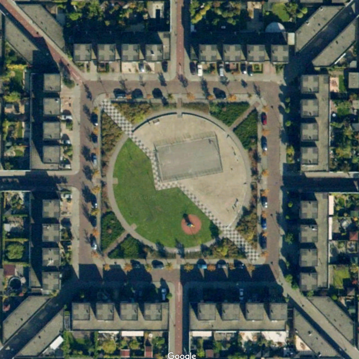 Off centered basketball court in the middle of a circular park.