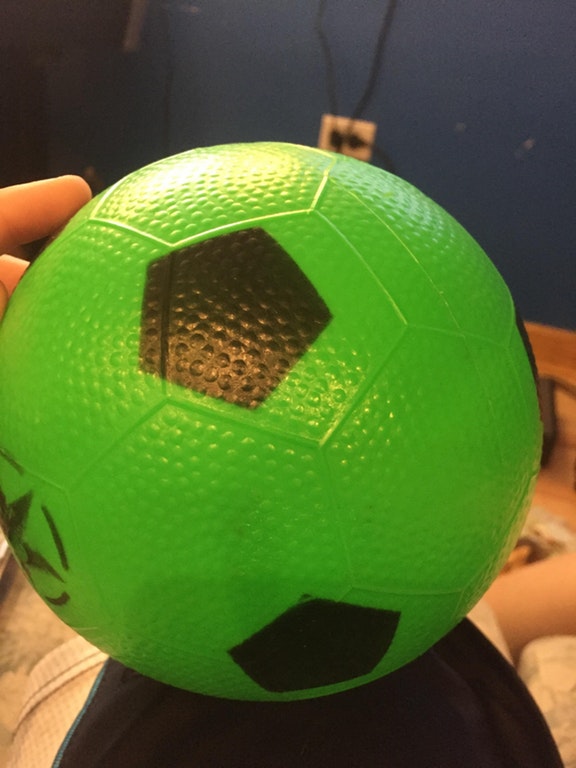 Soccer ball wit the pentagon shapes printed off their mark on the ball.