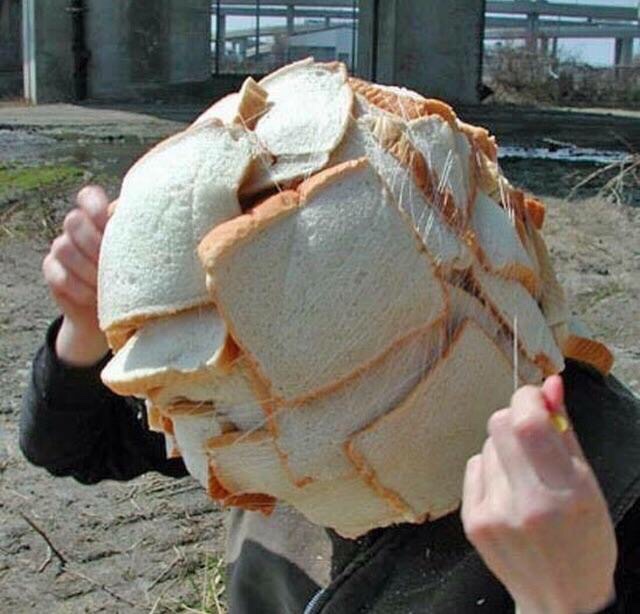 Cursed image of a person covering their head in white bread and wrapping it in fishing line