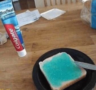 blue toothpaste spread on a slice of bread
