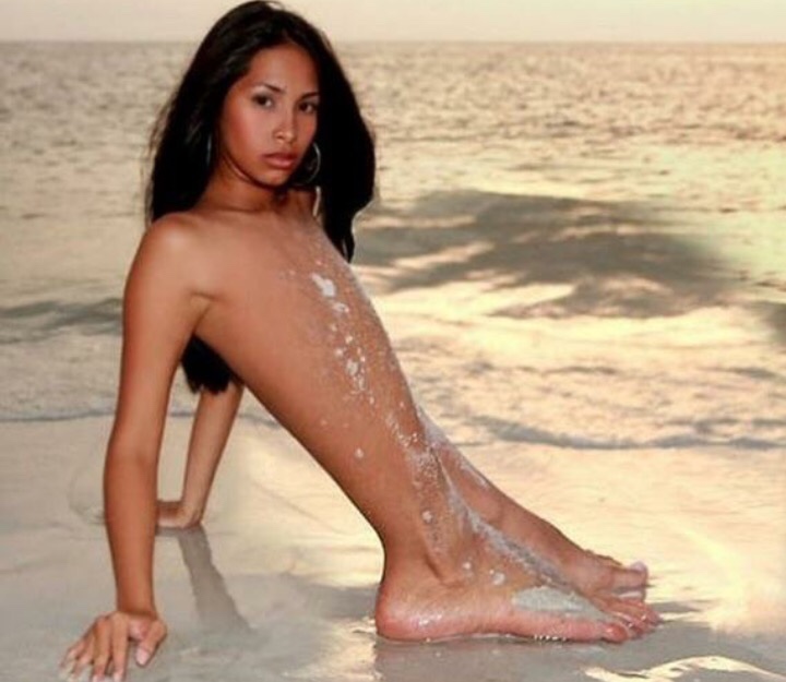 cursed image of a girl on the beach but her body is the lower legs only