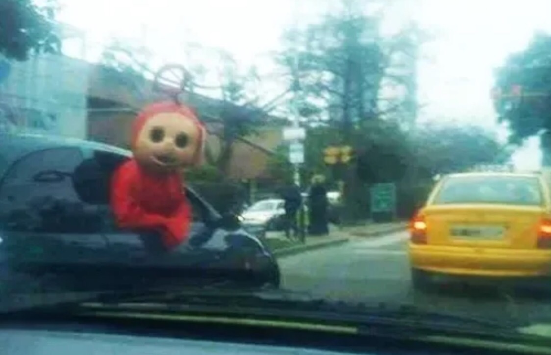 cursed image of a teletubby in the wild