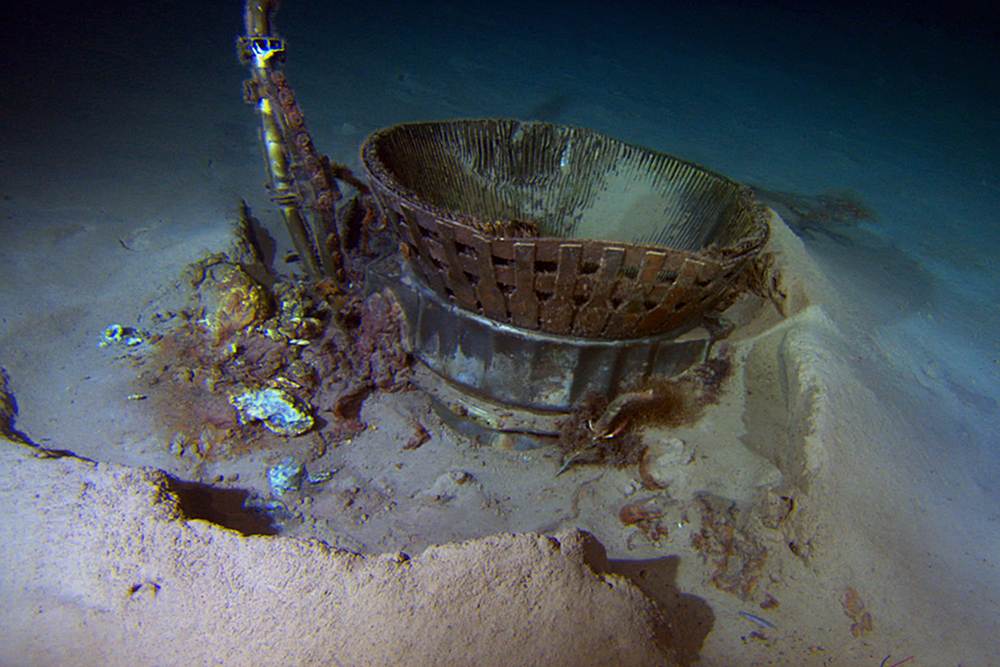 The thrust chamber from an F-1 rocket engine sits on the bottom of the ocean