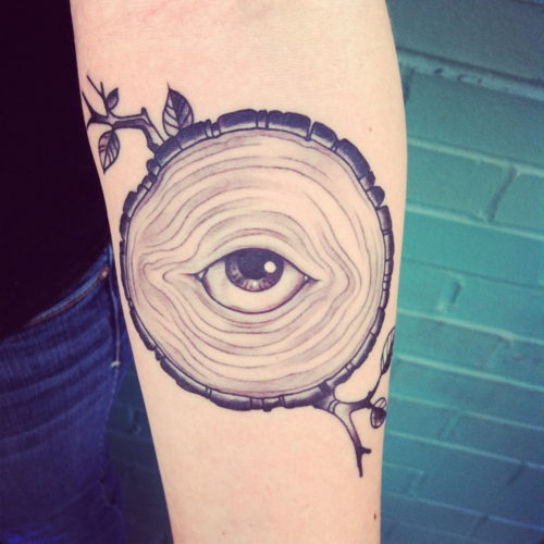 tree with eyes tattoo