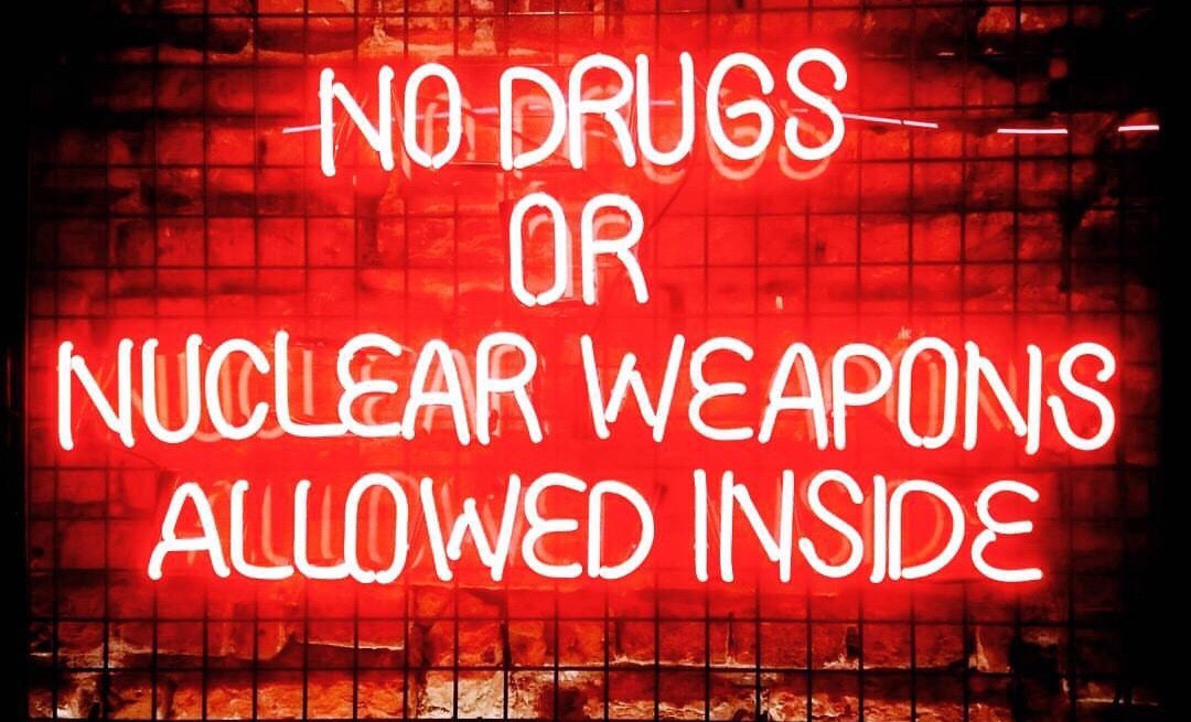 neon sign - No Drugs Tor Inuclear Weapons Allowed Inside