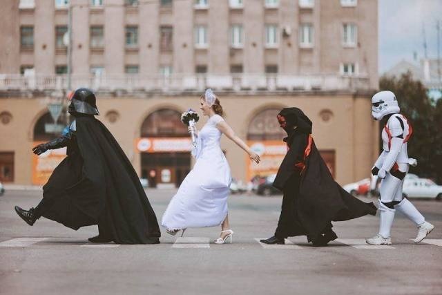 random picture of goofy bride and groom shots with star wars theme